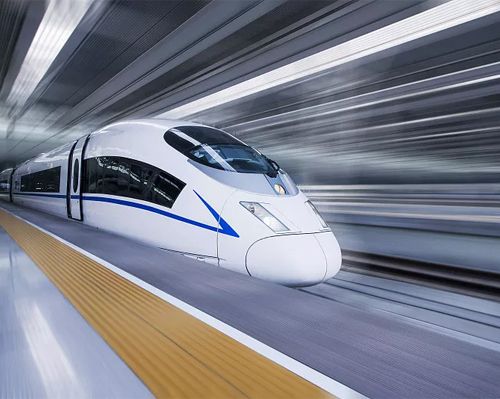 High-speed electric train passing along station platform, illustrating railway electrical connector application