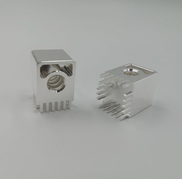 Silver-plated PCB mount connector blocks with integrated canted coil spring contacts and solder pins