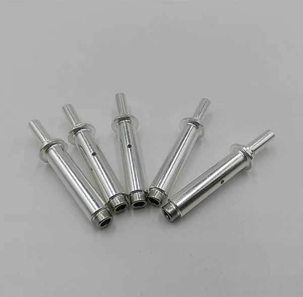Silver-plated precision machined connector socket terminals with crimp barrels and retaining flanges