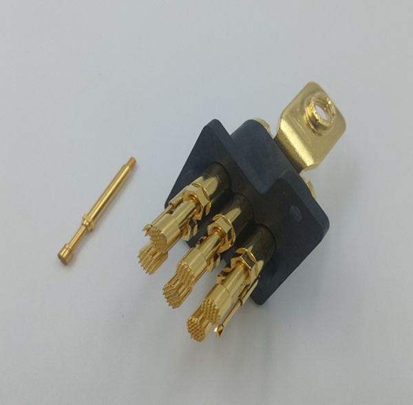 Gold-plated high-current spring probe connector block with serrated contact tips and loose pin