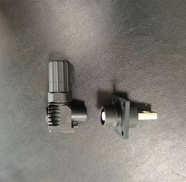 High-current energy storage connector plug and panel-mount flange socket with black plastic housing
