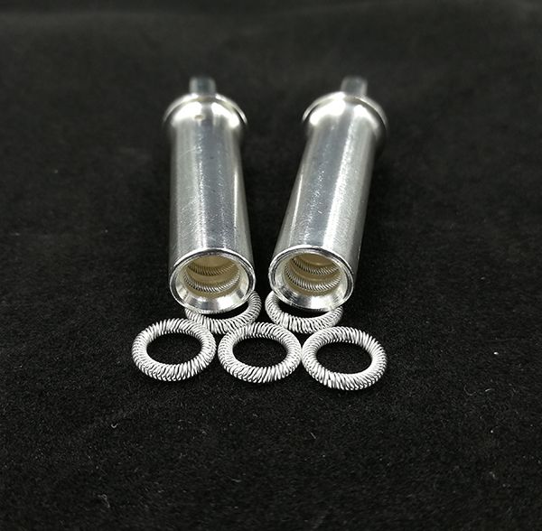 Silver-plated canted coil spring rings with two matching cylindrical female connector socket terminals