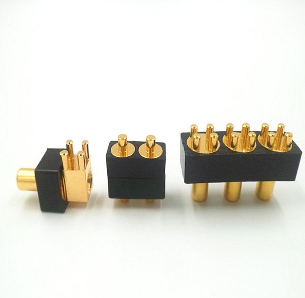Gold-plated custom connector pin blocks with black insulating housings in multiple pin configurations