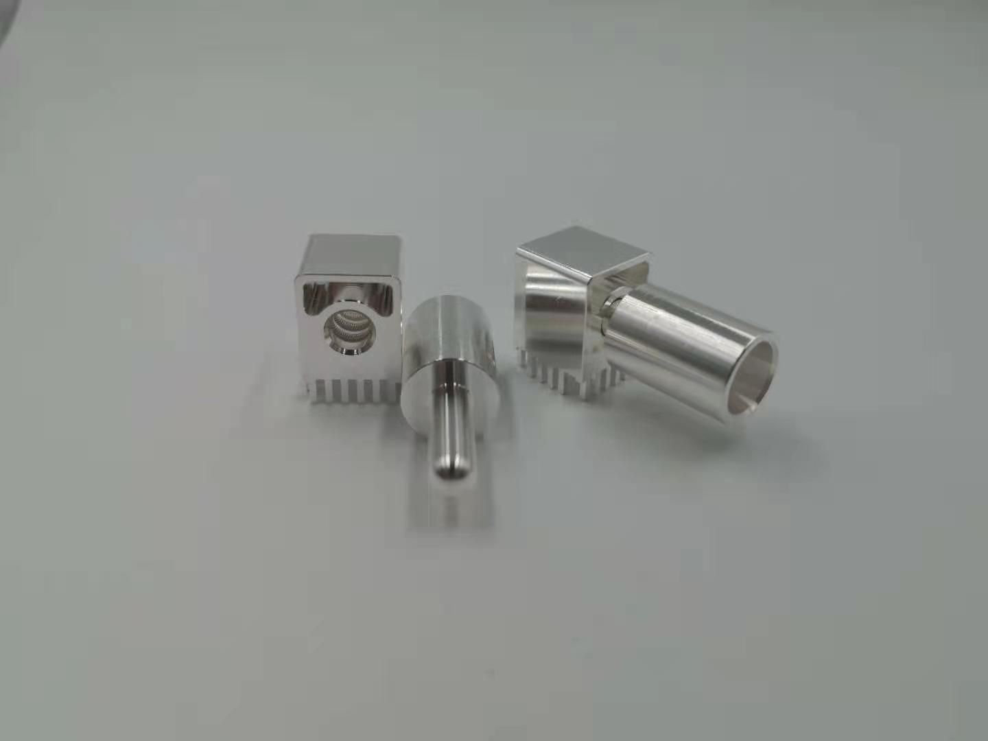 Silver-plated right-angle PCB power connector blocks with internal canted coil spring contacts and mating pin