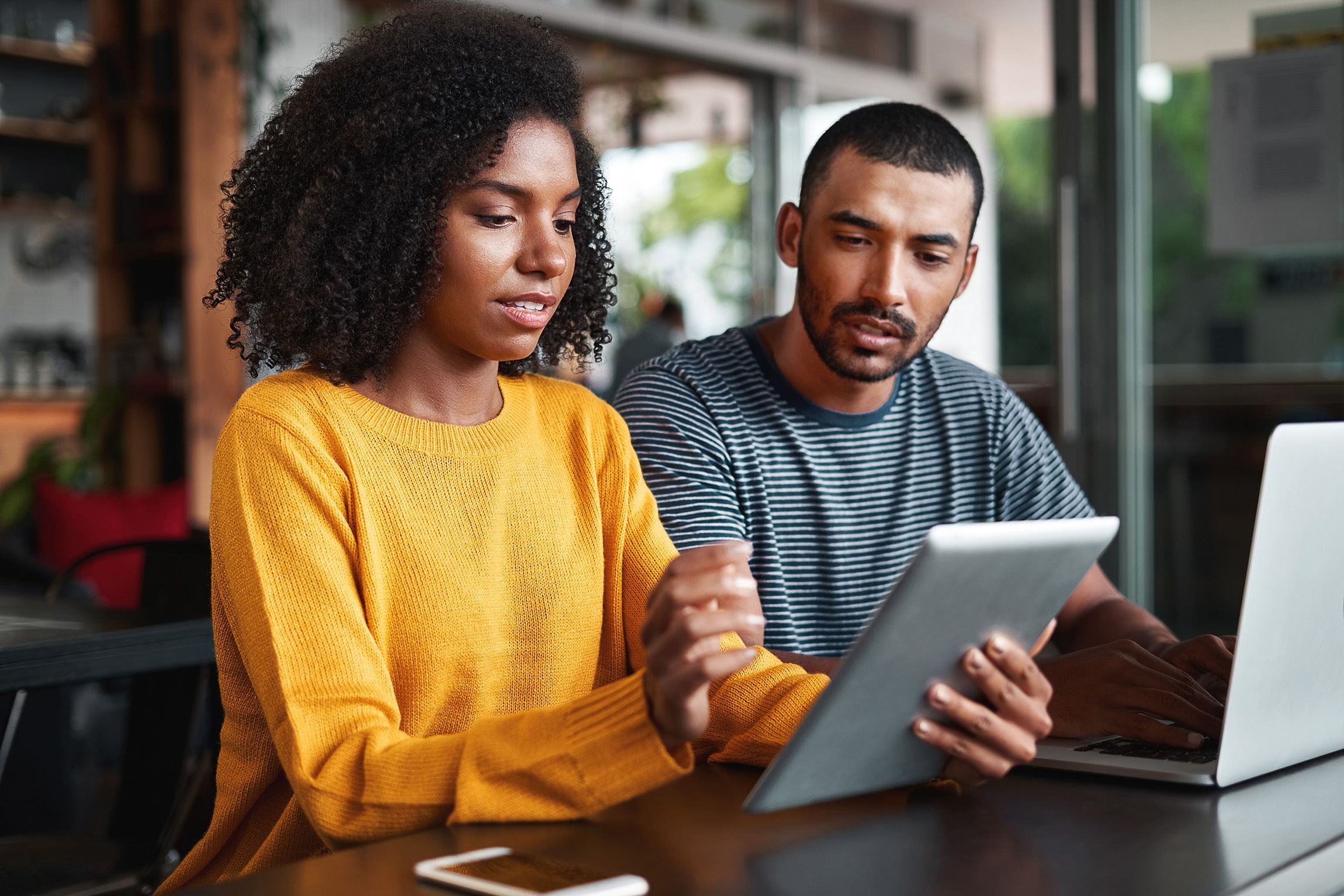 Couple looking at an ipad 