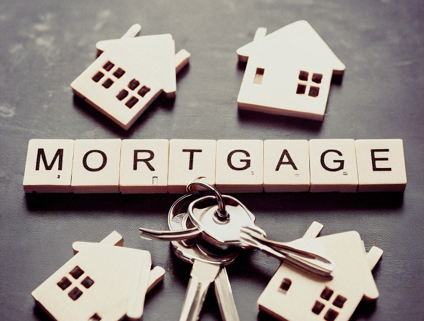 scrabble letters spelling out 'mortgage' with house keys beside them