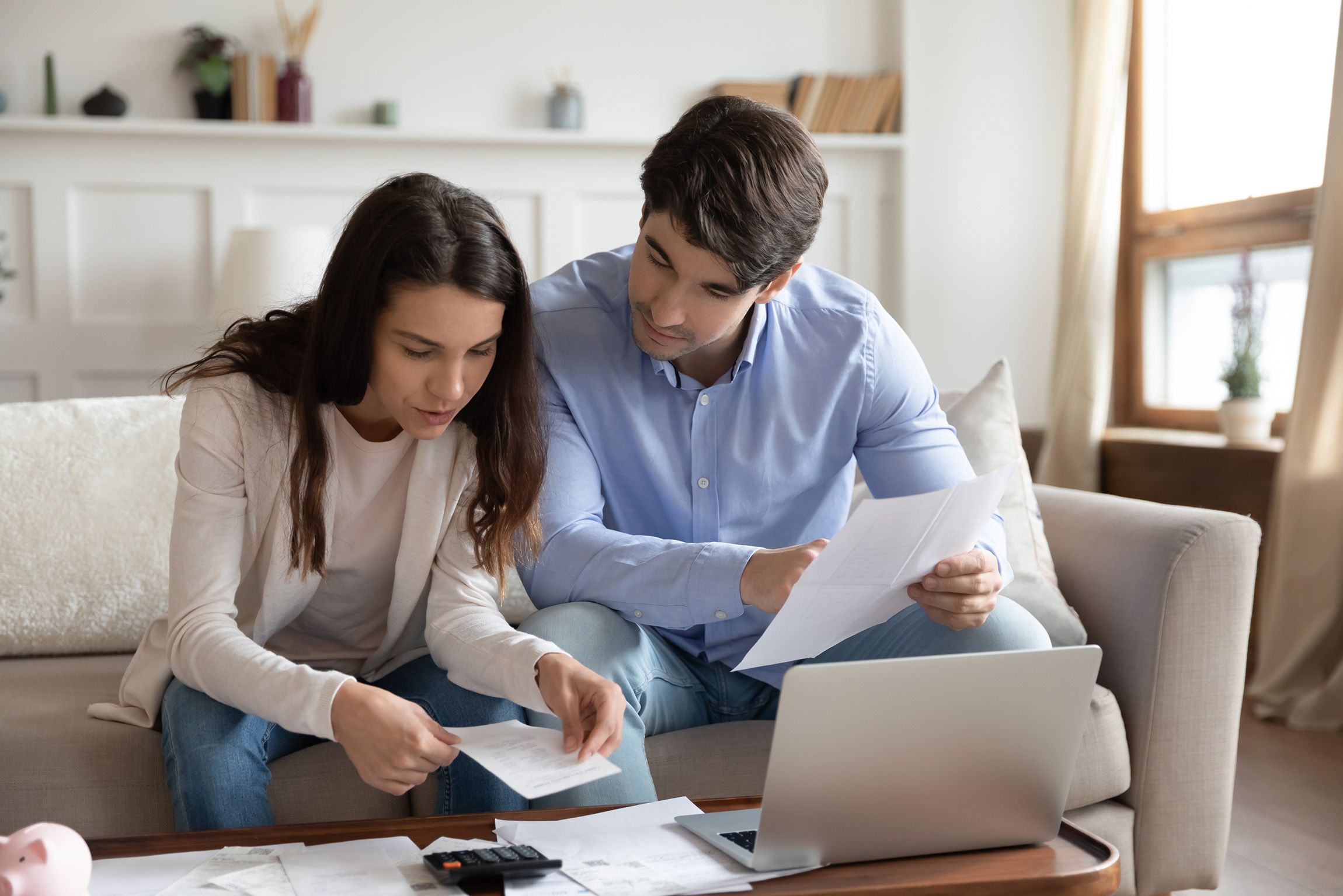 Young couple looking over pension documents