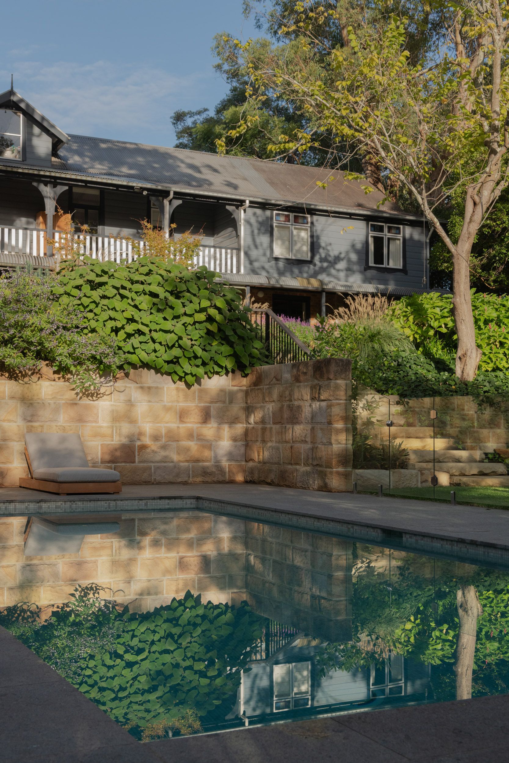 Pool and sandstone wall
