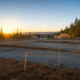 Excavator preparing a building lot for foundation work