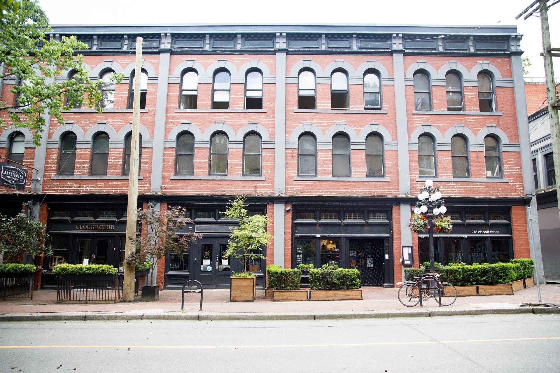 Beuatiful property on the corner with people on the street