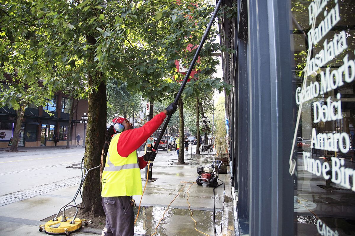 White and blue brick building with storefront 