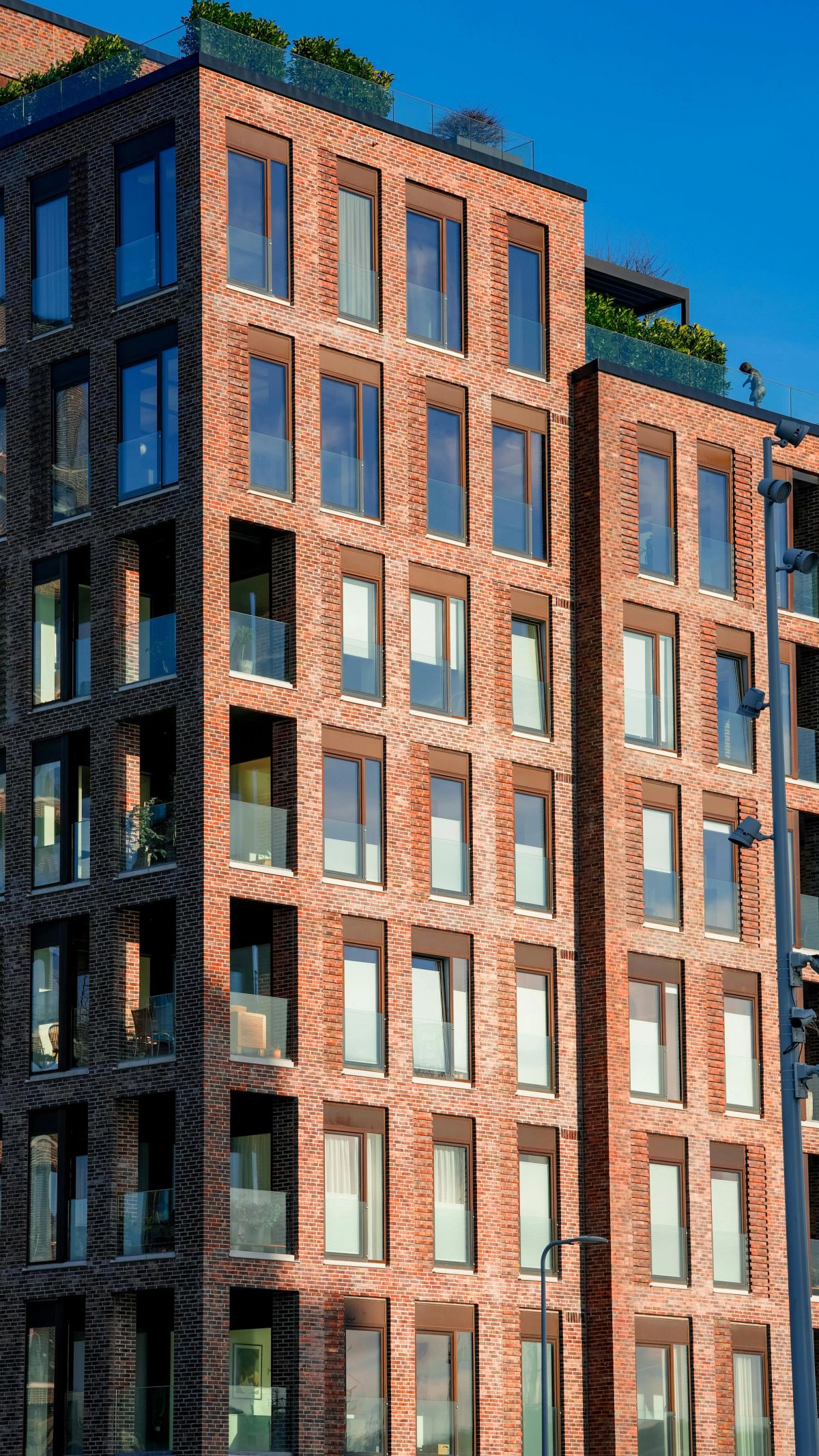 tall apartment building brick and windows 
