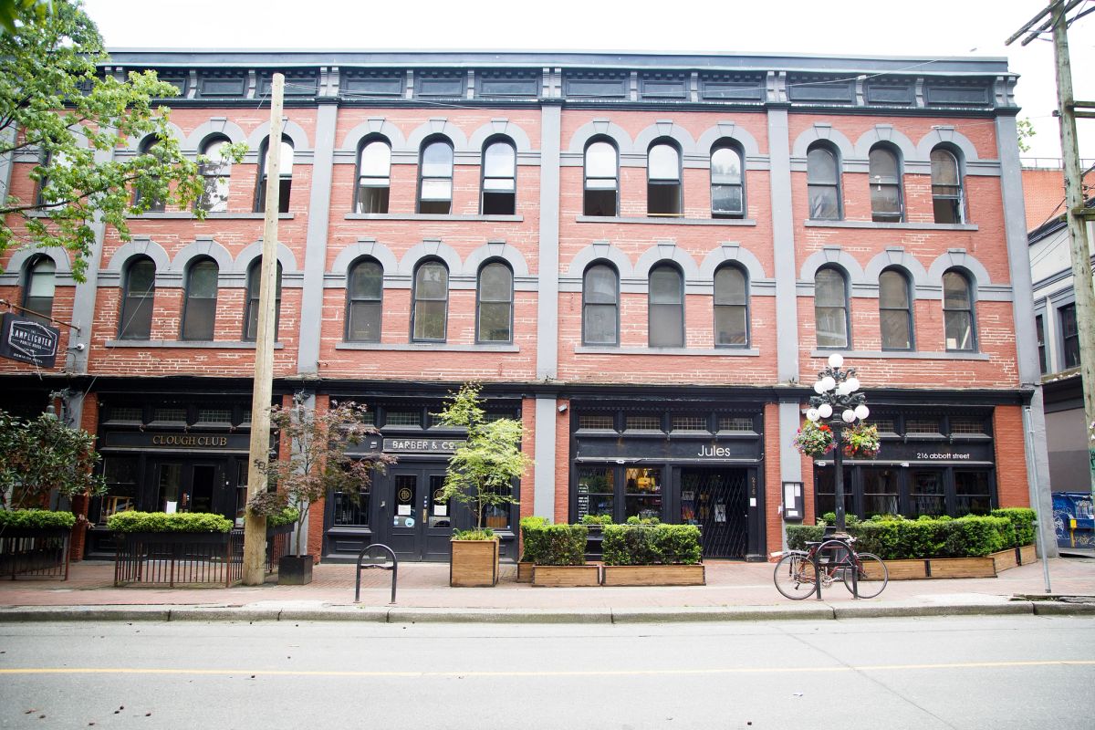 Beuatiful property on the corner with people on the street