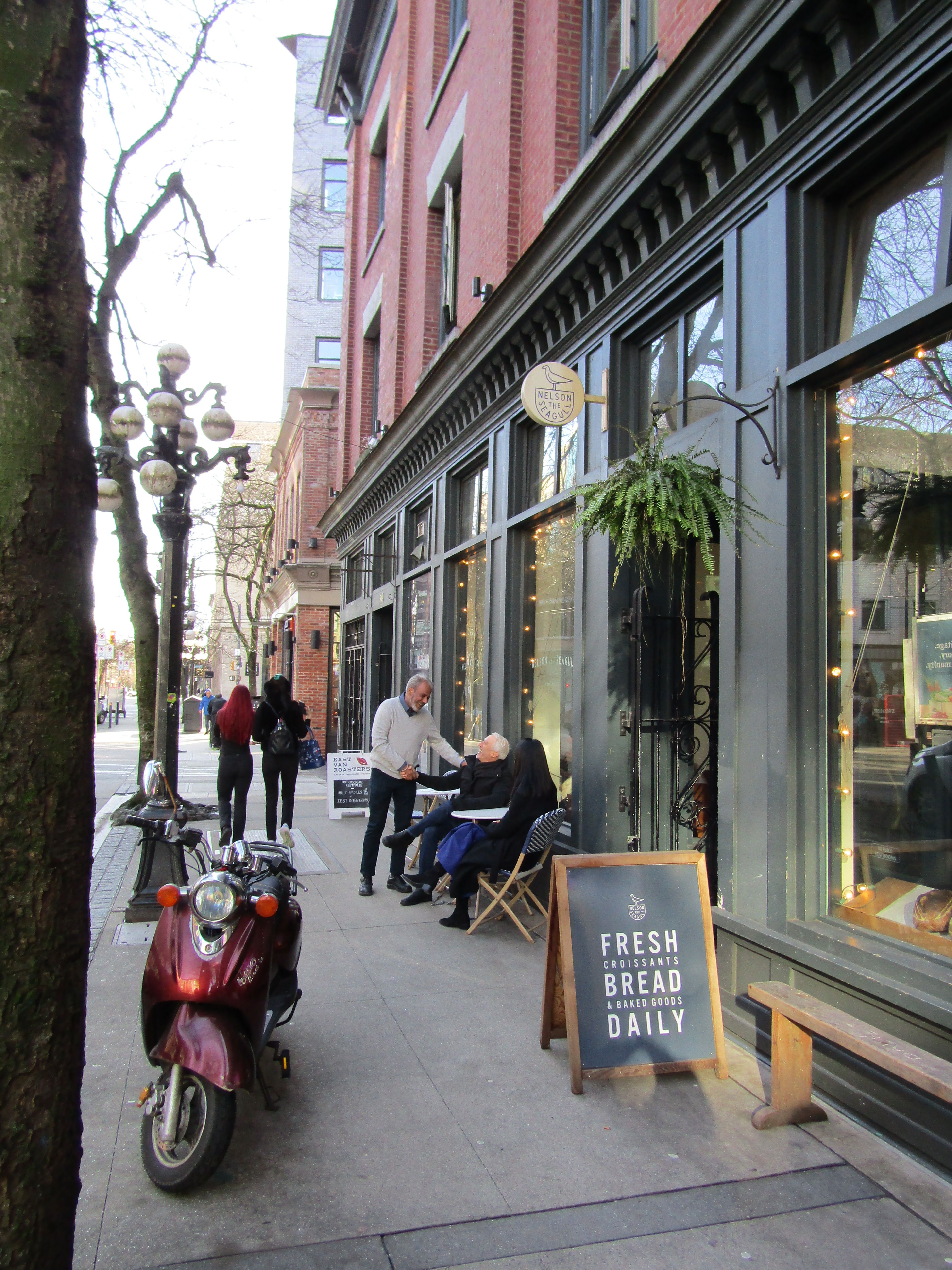 People meeting outside of a business