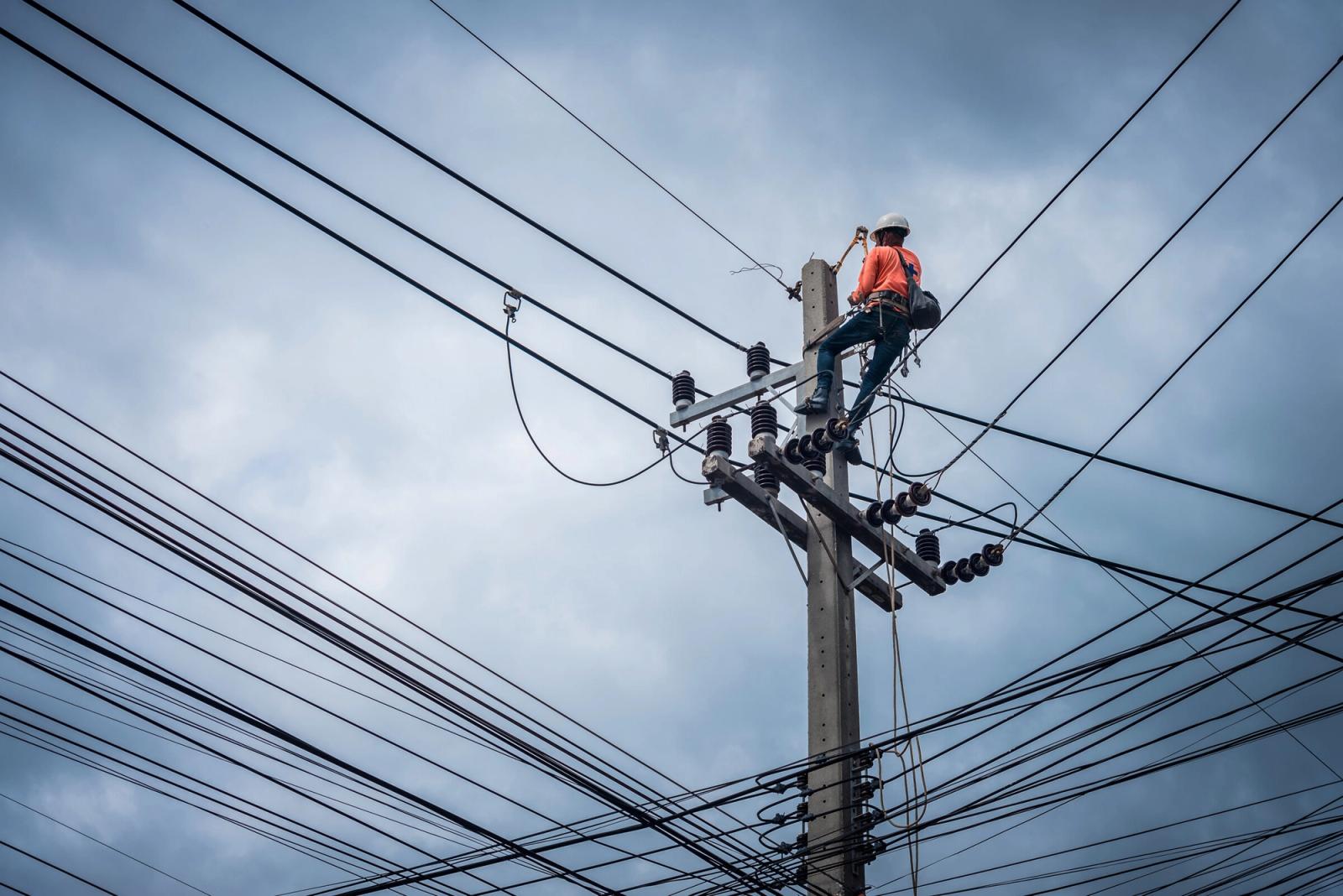 Lineman on electrical pole — Twin Cities electrical contractor