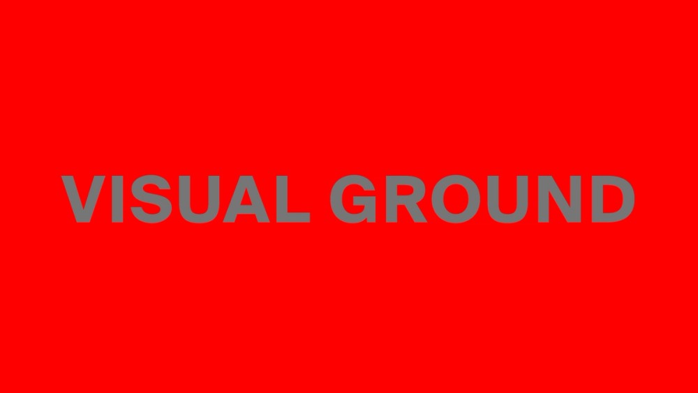 Words "VISUAL GROUND" in gray in front of red background