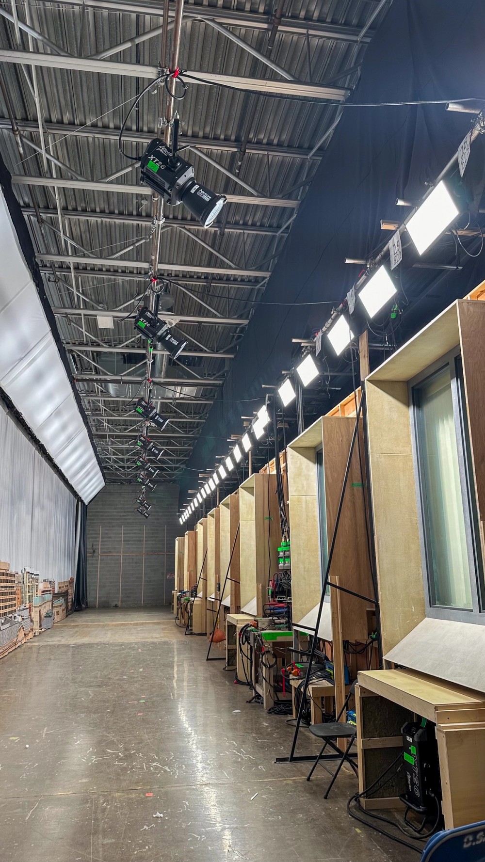 Electro Storm XT26’s rigged along speedrail, capable of being de-rigged and loaded onto truck for location shoots while cabling remained rigged on the soundstage