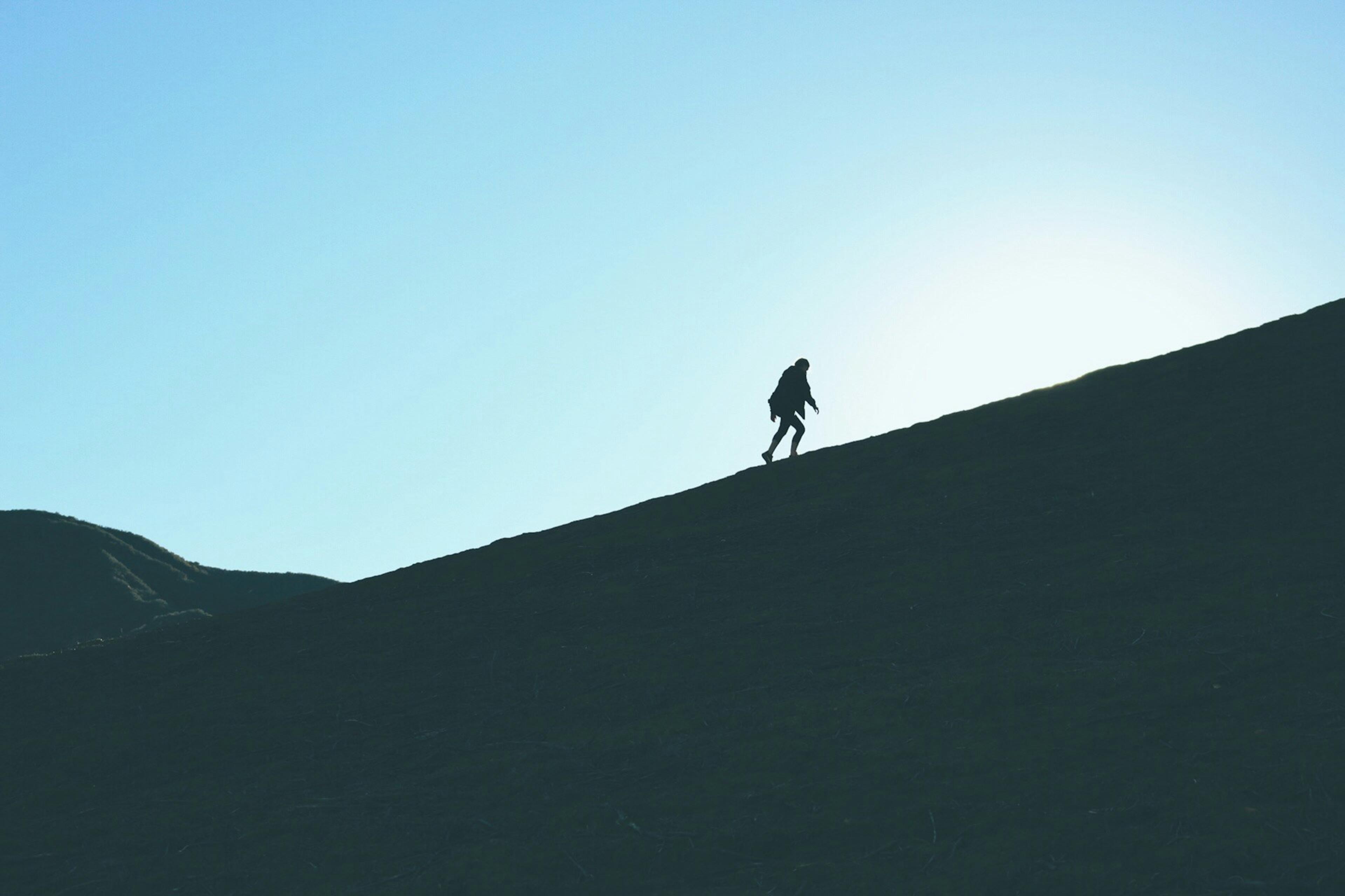 Person climbing a mountain
