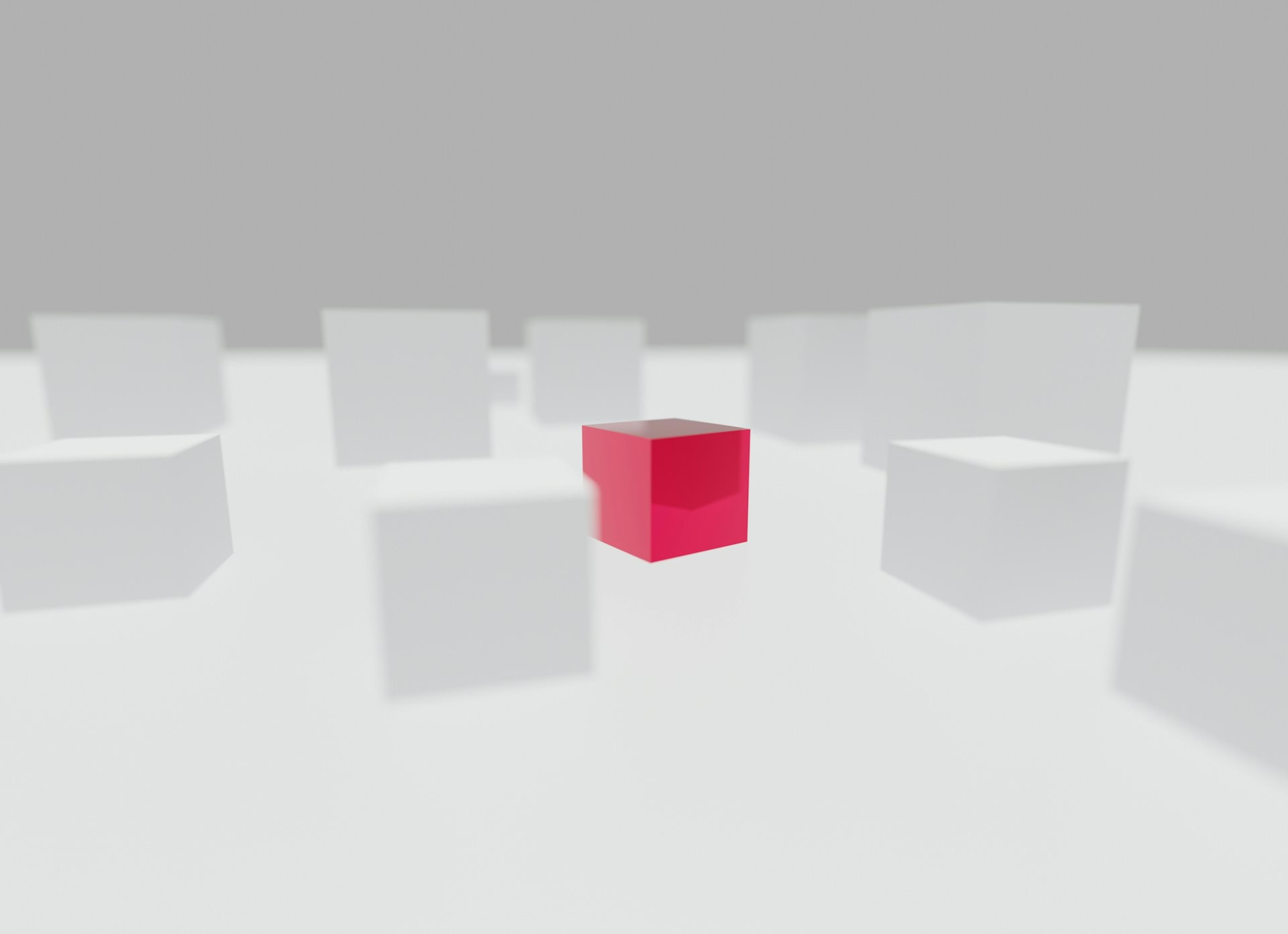 Individual red cube amongst other cubes