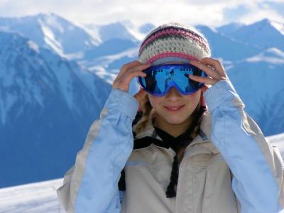 Girl skiing in the mountains.