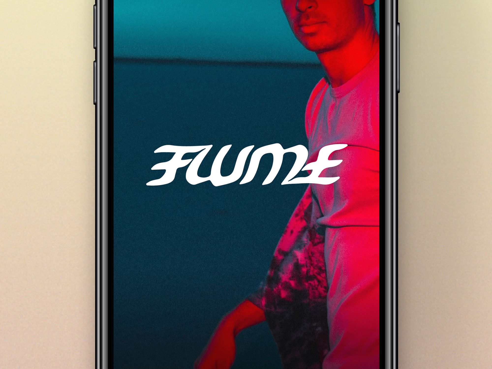 iPhone with "Flume" text designed by Jonathan Zawada overlaid onto Flume press image