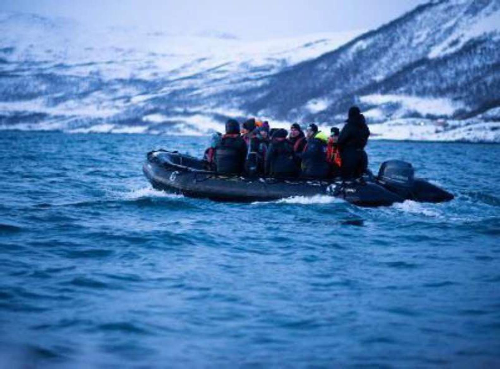 Guests in a zodiac beside the ship