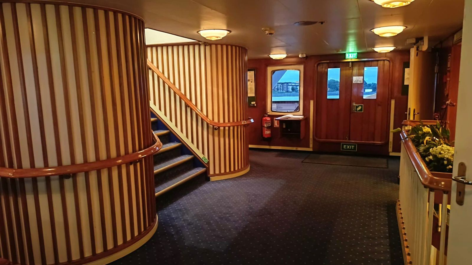 Panelled hall with brass and timber detail