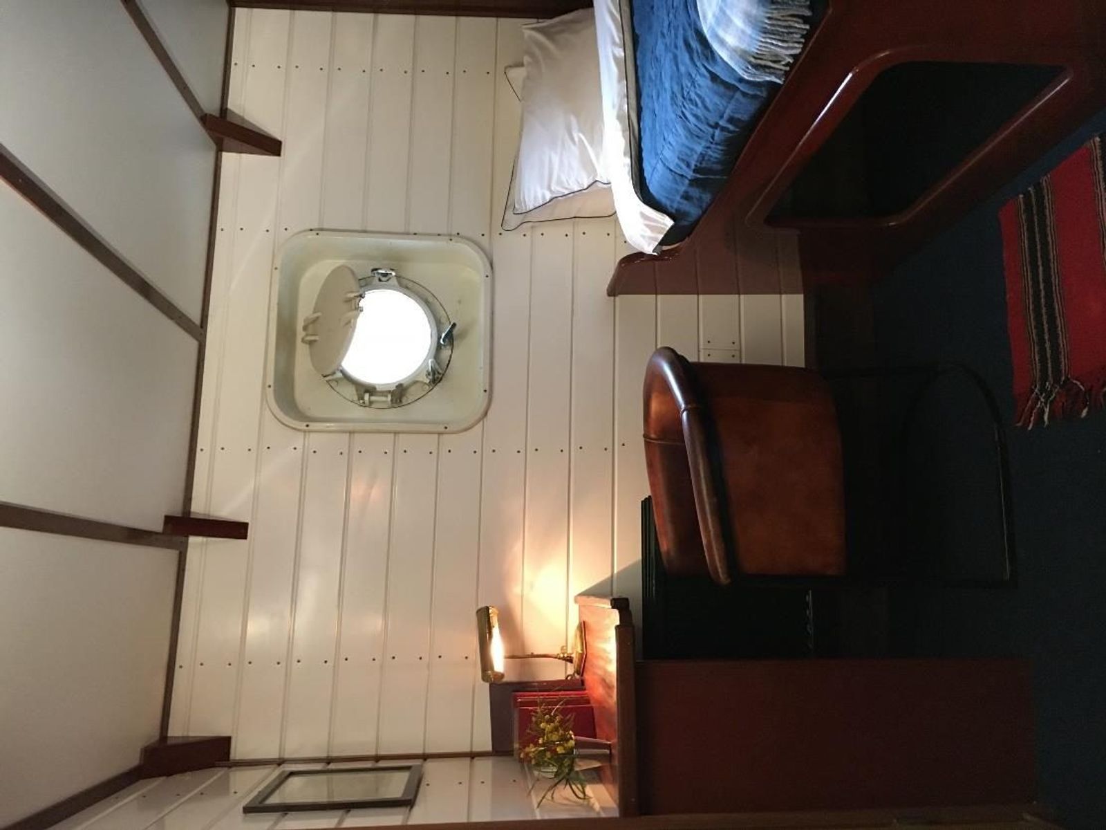 A single cabin with a porthole aboard M/S Balto