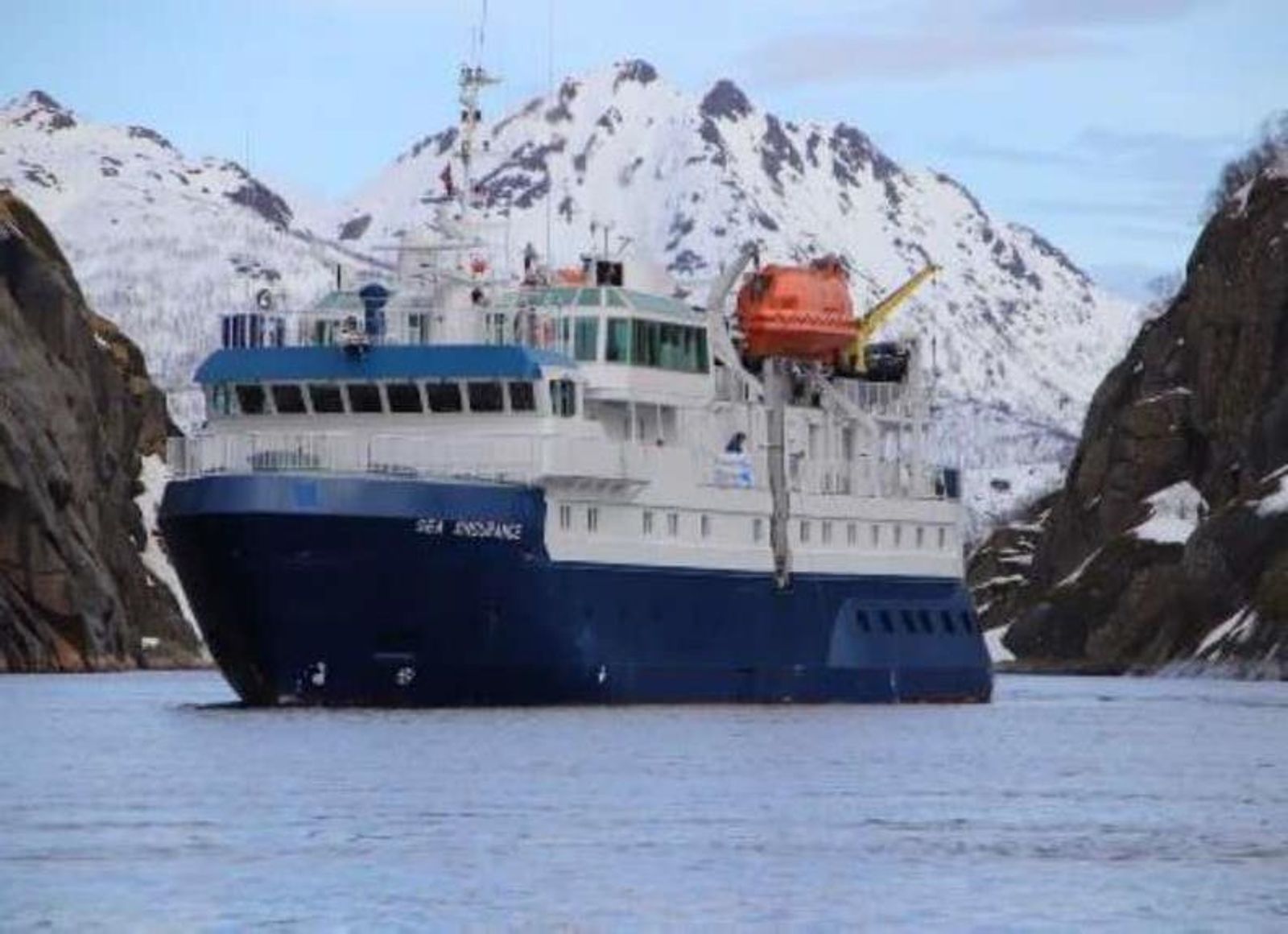 M/S Quest below snow-covered mountains