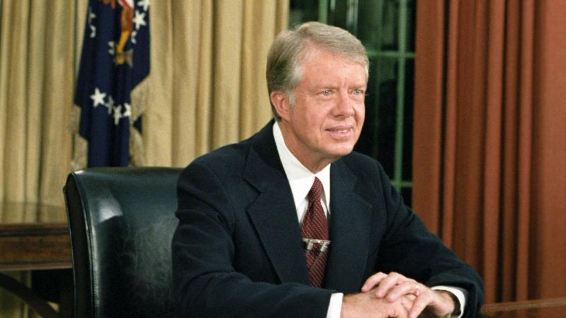 President Jimmy Carter at his desk in the Oval Office (1978).