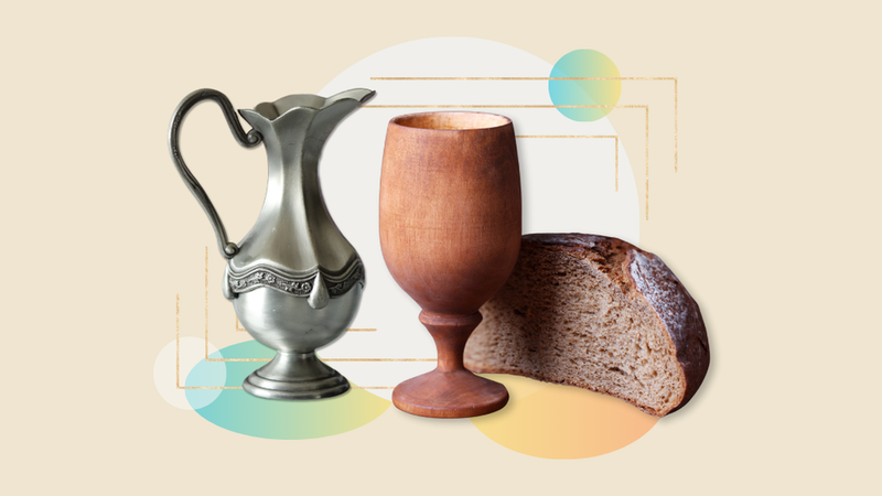 Silver pitcher for baptism with a carved wooden wine goblet and half a loaf of whole grain bread.