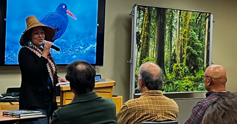 Loni Greninger addresses the crowd at the Salmon Cedar Rock and Rain launch event.