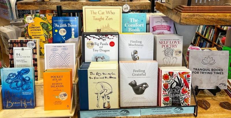 Books from the Tranqull Books for Troubled Times list with their covers visible on a shelf display.