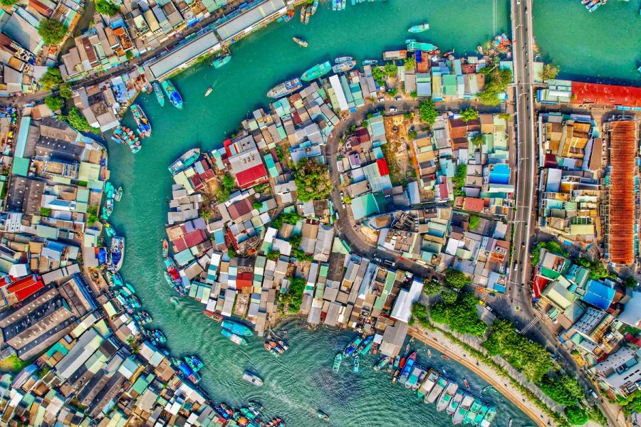 From the drone’s unique perspective, Vietnams island town of Phu Quoc emerges as a vibrant tapestry of narratives. The turquoise river is the crucial artery of this town, hosting many fishing boats, some heading out to sea. On land, a mosaic forms – buildings, trees, and roads create harmony, leaving no inch of land unused. To me, this is where stories unfurl: the lives behind the structures, the journeys of boats and cars, and the whispers of history. This is what i love about drone photography, the perspectives which otherwise would be impossible.