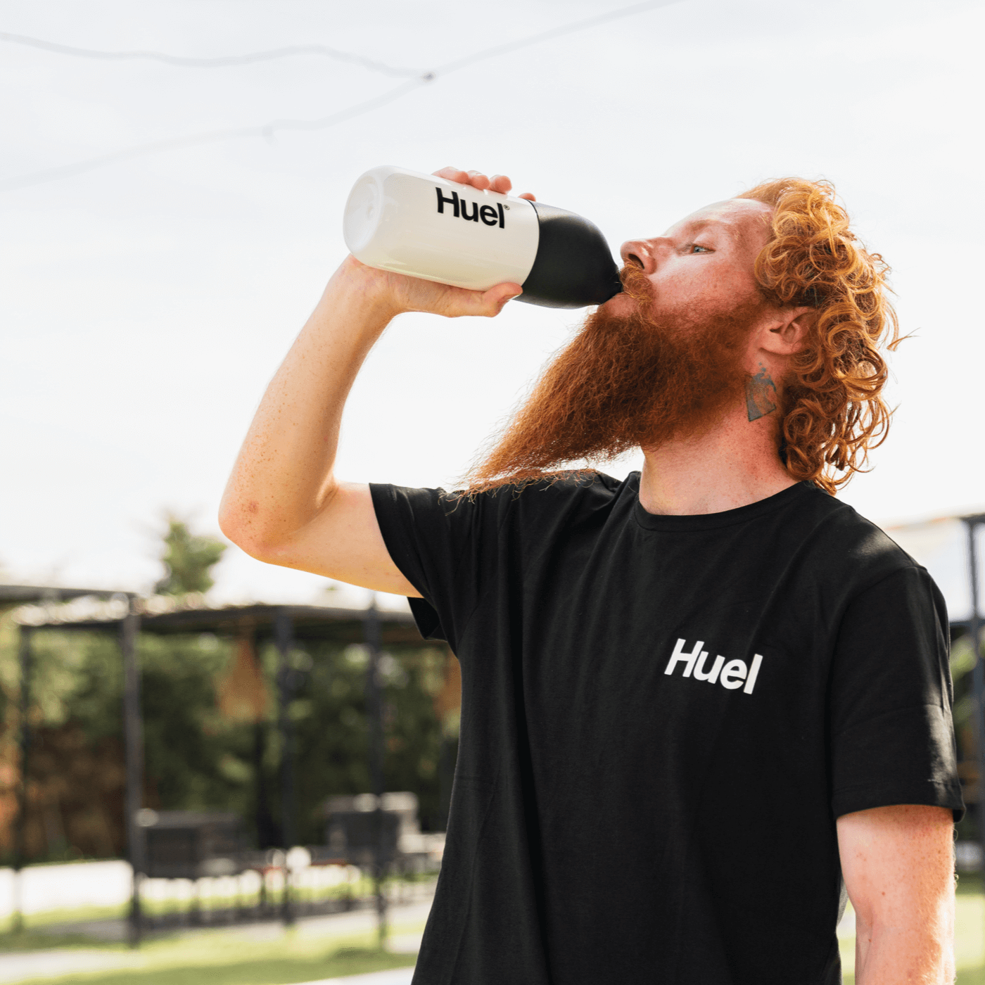 Close-up image on a corner of a Black Huel t-shirt