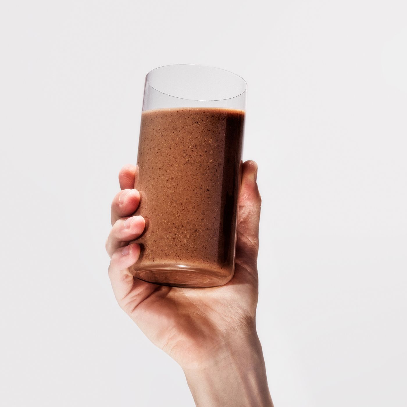 Huel Black Edition chocolate flavour being poured into a glass