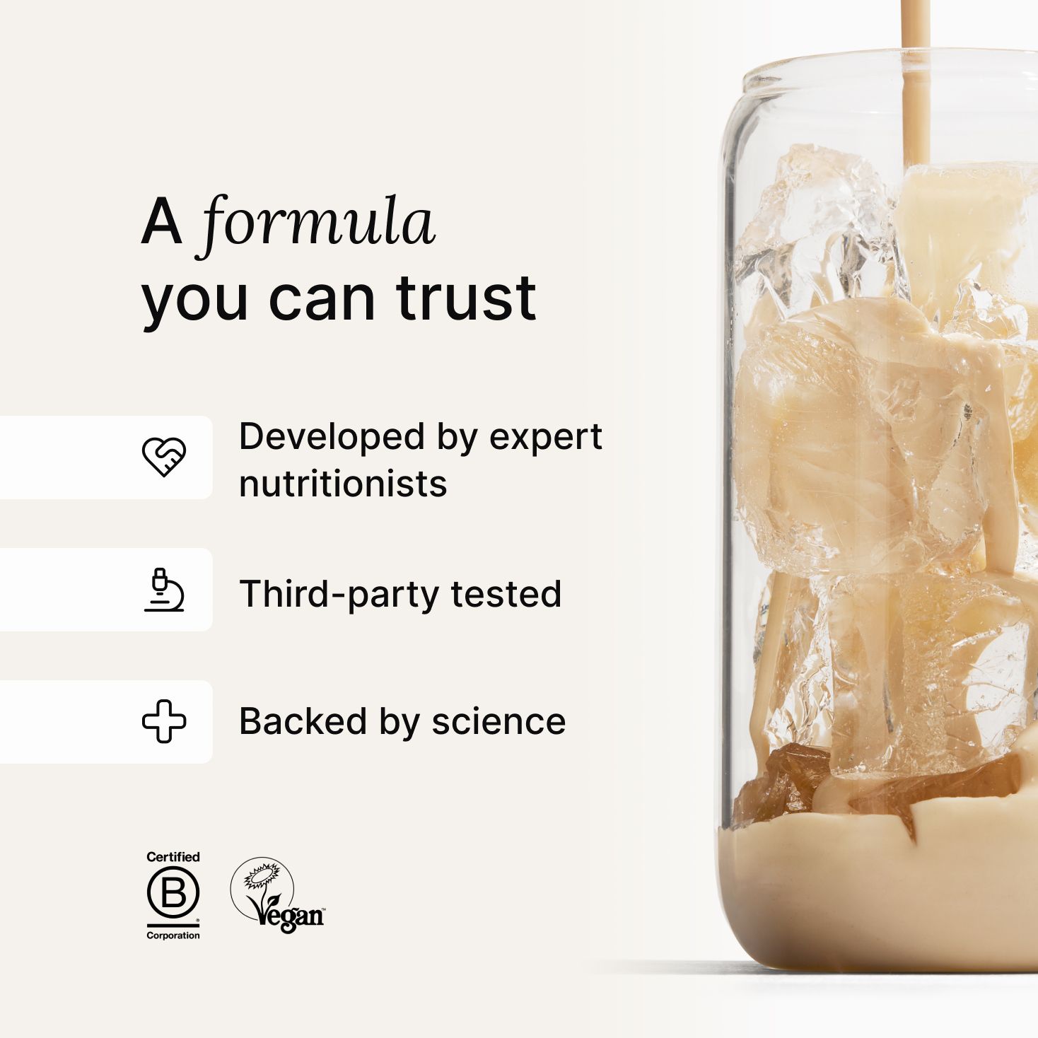 A glass of ice being filled by huel complete protein liquid