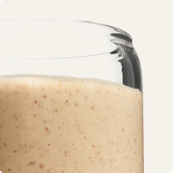 A glass containing Huel Powder