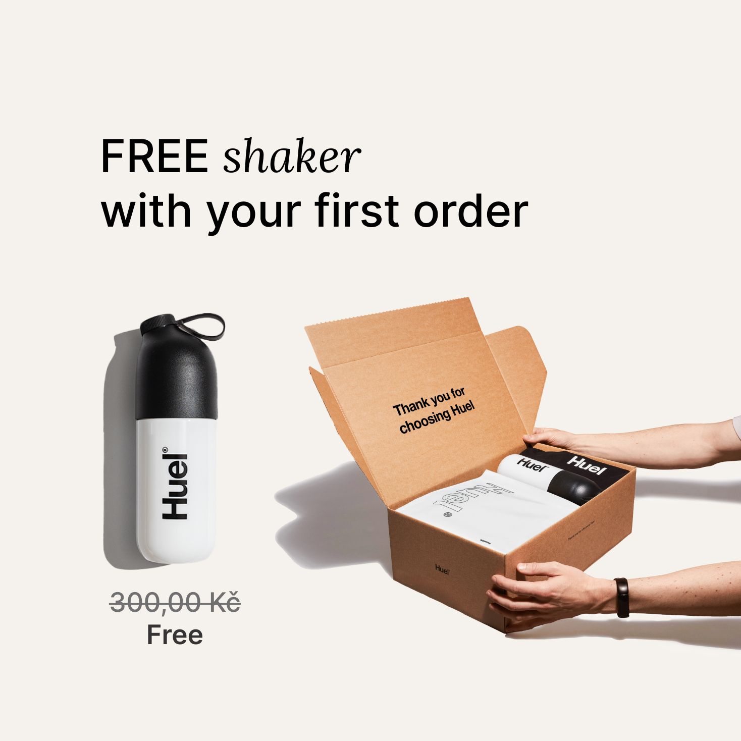 someone holding a Huel box containing a white powder bag, and a black and white shaker, on a neutral background