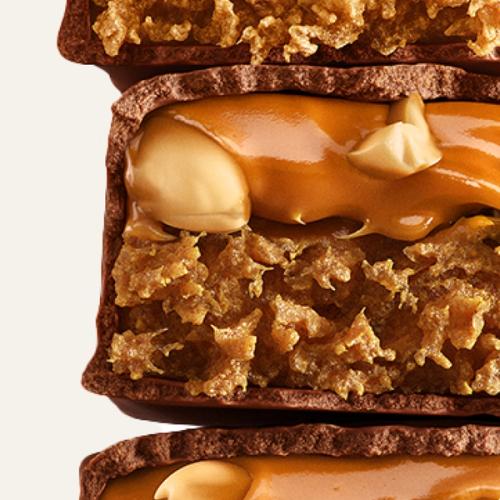 Close-up of broken Peanut Caramel Complete Nutrition Bar