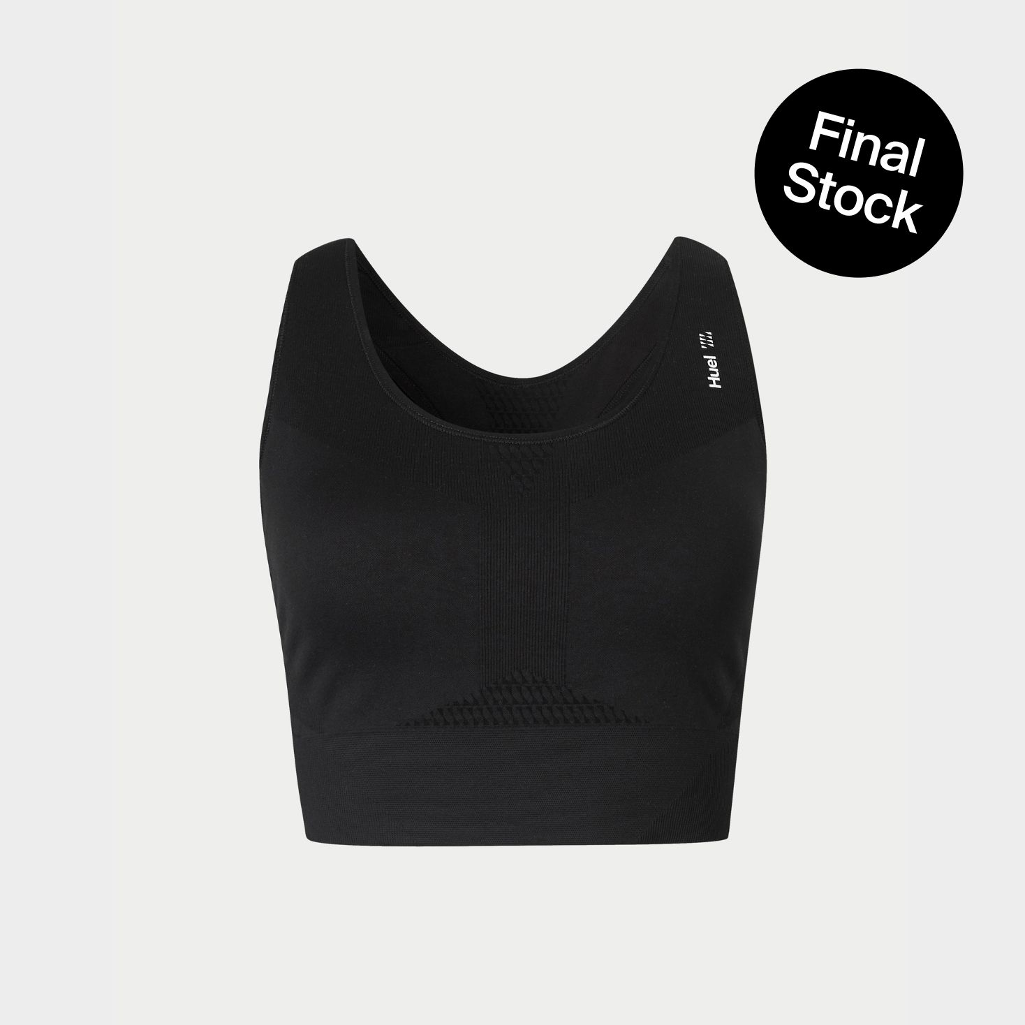 A black sports bra on a beige background