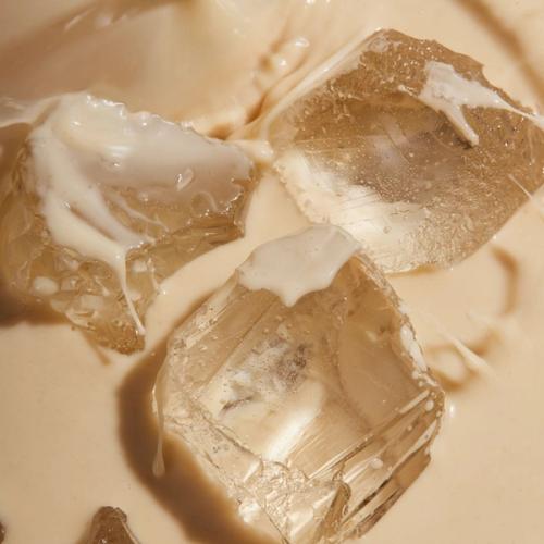 Huel Vanilla RTD with ice cubes in a glass