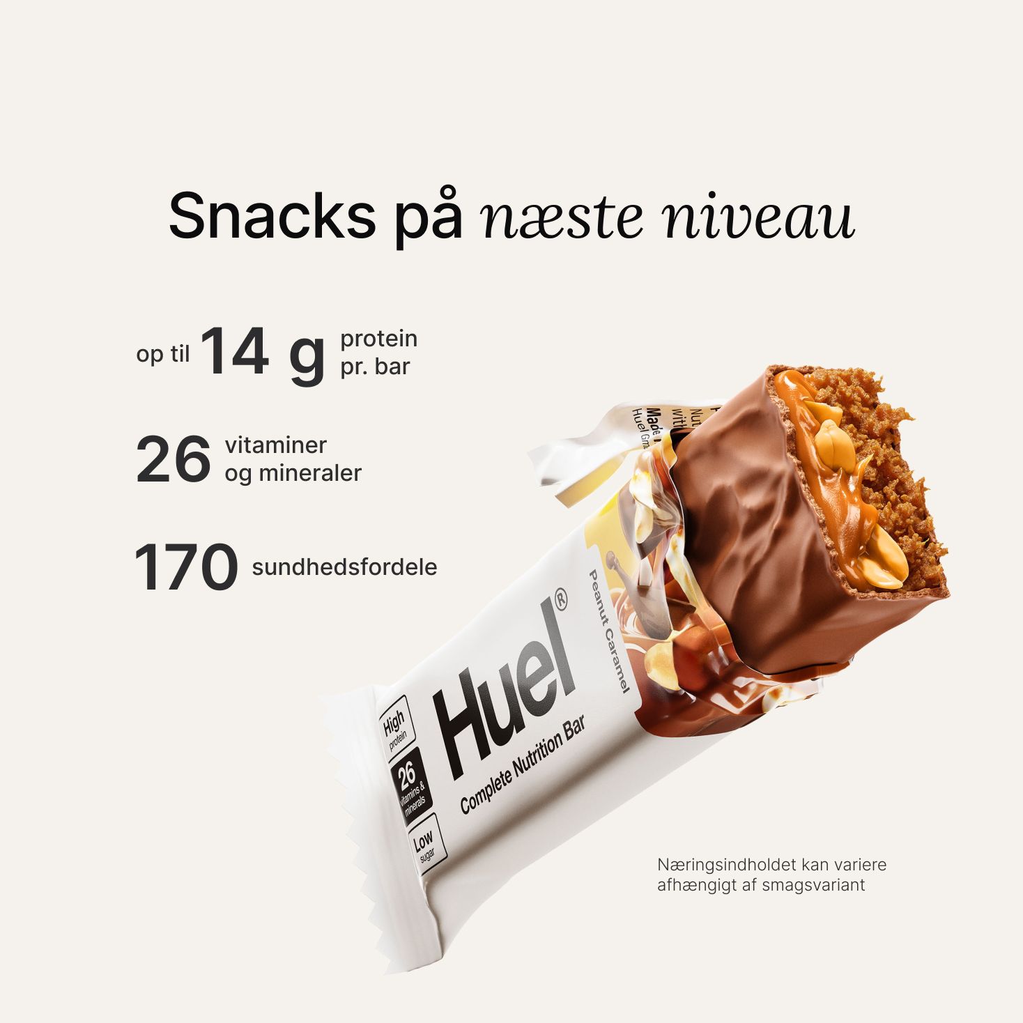 A Huel Complete Nutrition bar with a peanut and caramel filling, set against a beige-colour background