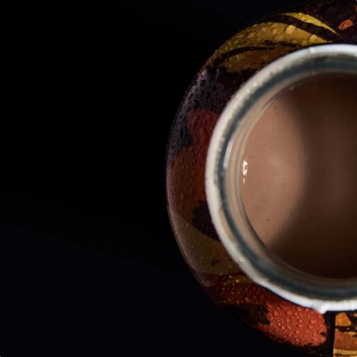 Huel Chocolate Peanut Butter Black Edition RTD with ice cubes in a glass