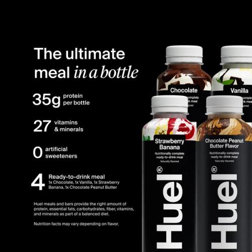 A hand holding a bottle of Huel Black Edition ready-to-drink on a black background