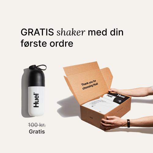 someone holding a Huel box containing a white powder bag, and a black and white shaker, on a neutral background