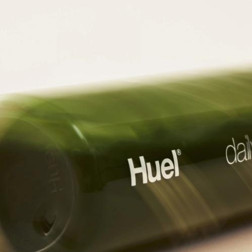 Daily Greens bottle laying on its side