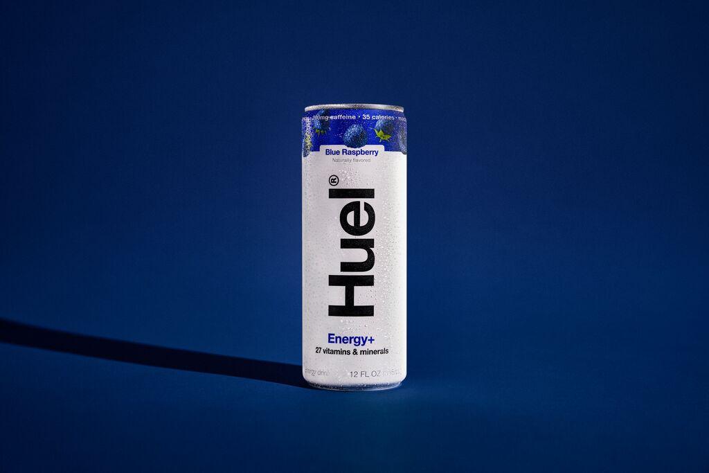 Energy + Blue Raspberry Can against a blue gradient