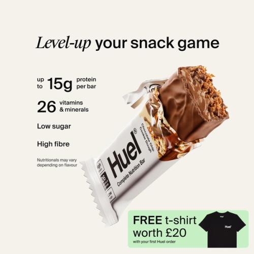 A Huel Complete Nutrition bar with a peanut and caramel filling, set against a beige-colour background