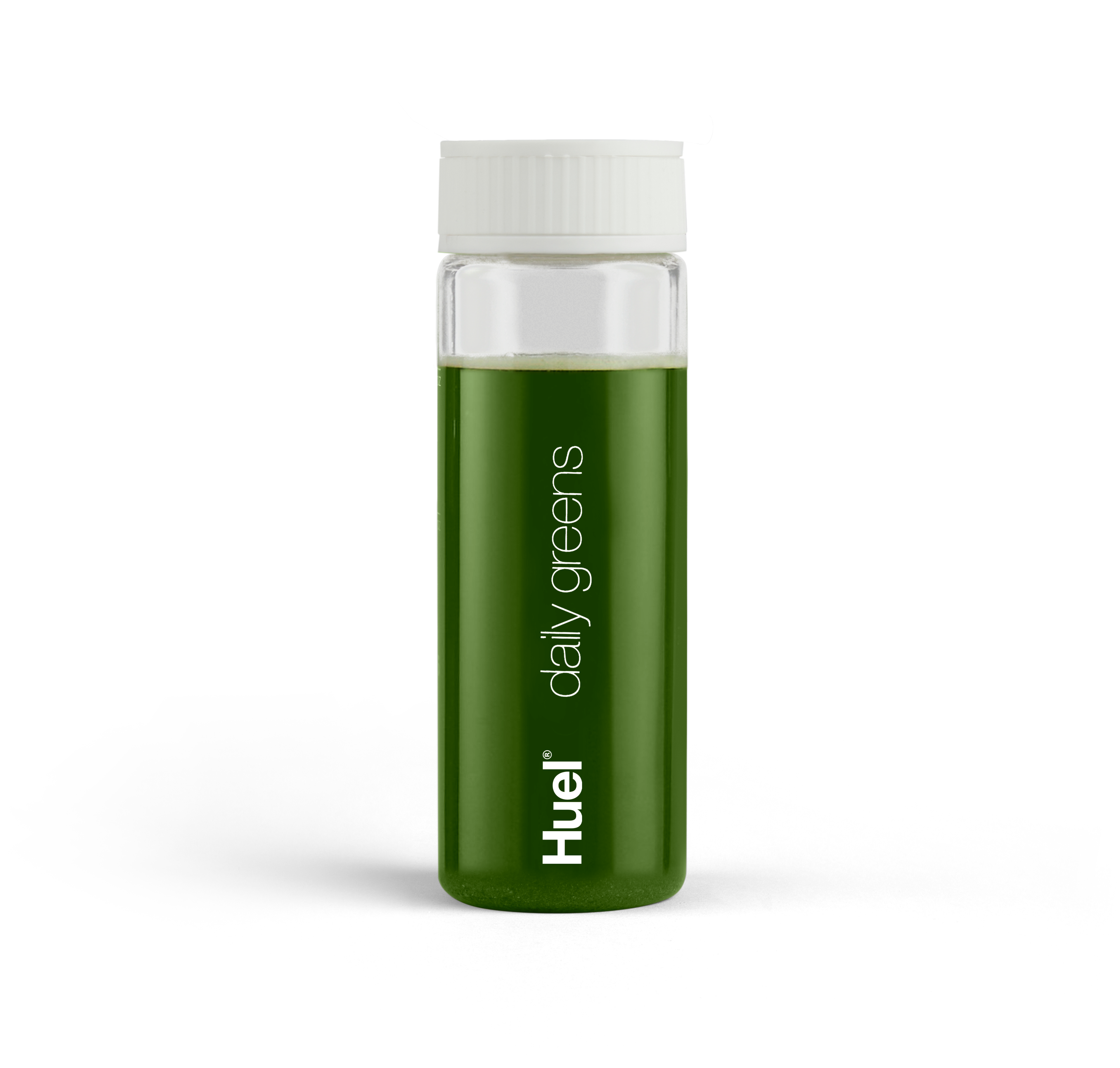 Eine Flasche Huel Daily Greens vor einem Hintergrund aus weißem Pulver